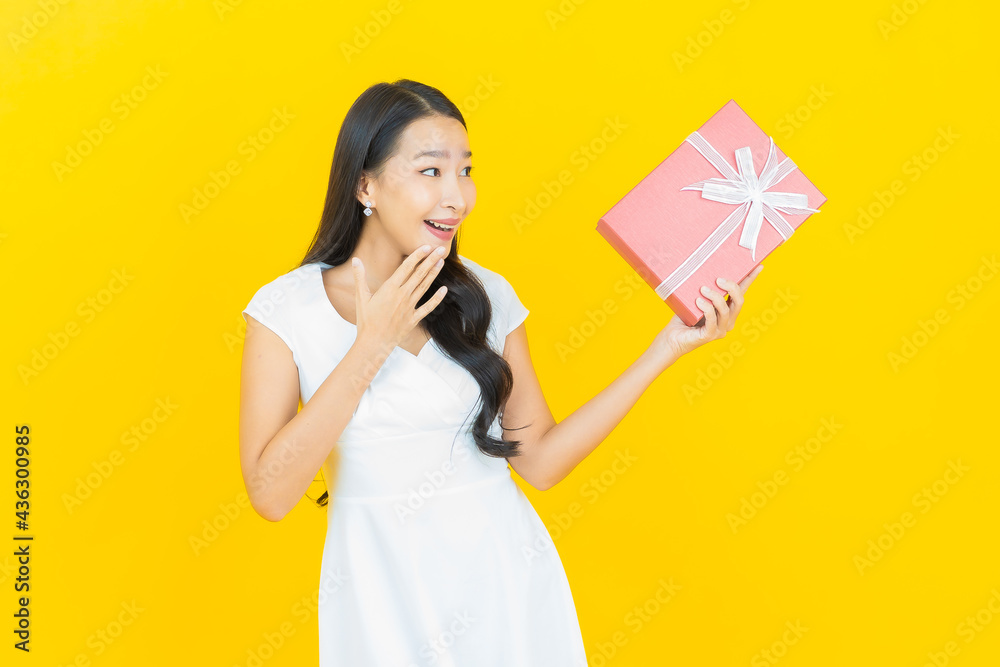 Portrait beautiful young asian woman smile with red gift box Portrait beautiful young asian woman smile with red gift box