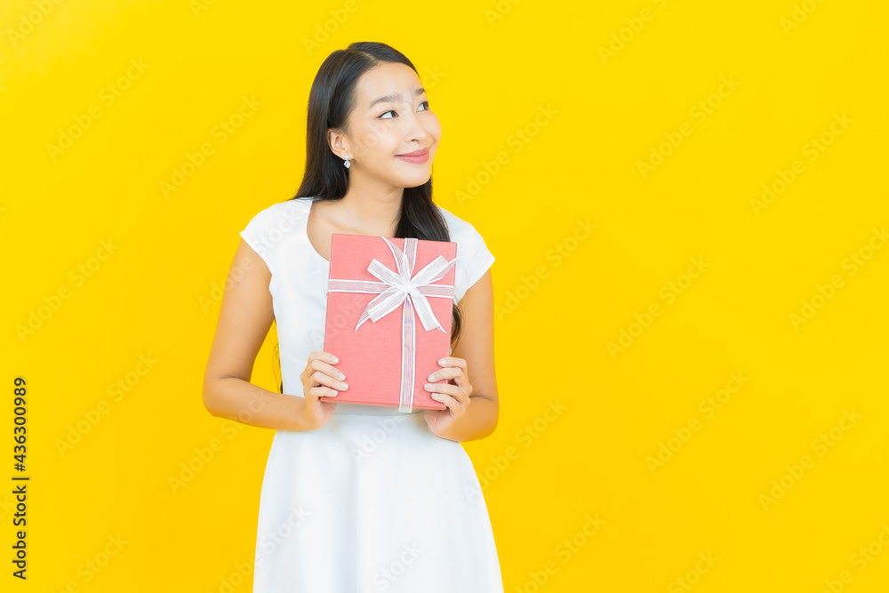 Portrait beautiful young asian woman smile with red gift box Portrait beautiful young asian woman smile with red gift box