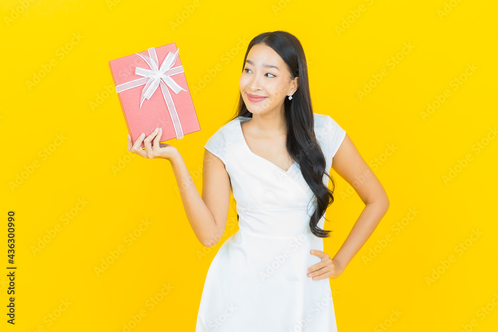 Portrait beautiful young asian woman smile with red gift box Portrait beautiful young asian woman smile with red gift box