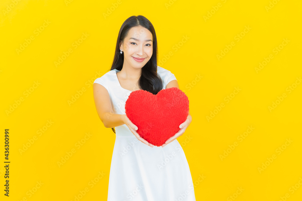 Portrait beautiful young asian woman smile with heart pillow shape Portrait beautiful young asian woman smile with heart pillow shape