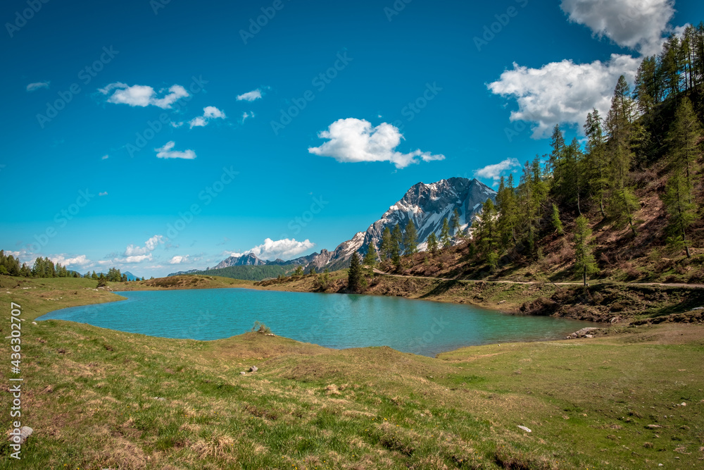 Calm lake in a sunny day  in the beautiful Carnic Alps, Friuli-Venezia Giulia, Italy