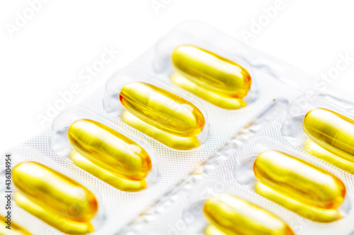 Yellow transparent pills of fish oil
