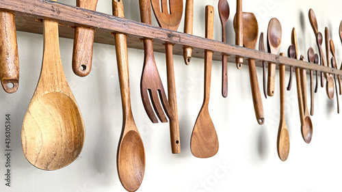 Wood Kitchen Utensils on the wall.