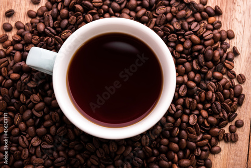 Cup of coffee with Coffee beans  closeup