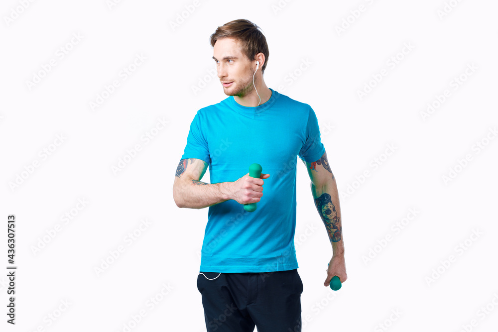 man with dumbbells in hands in headphones fitness exercise man with dumbbells in hands in headphones fitness exercise