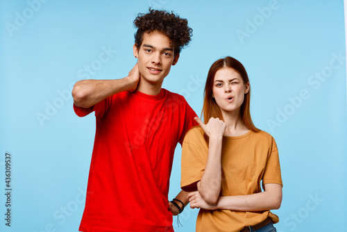 man and woman in multicolored t-shirts communication emotions modern style