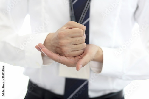 Businessman putting fist on palm. Full of confident and vision in business and work