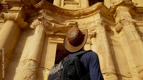 Explorer Viewing Petra Ruins in Awe