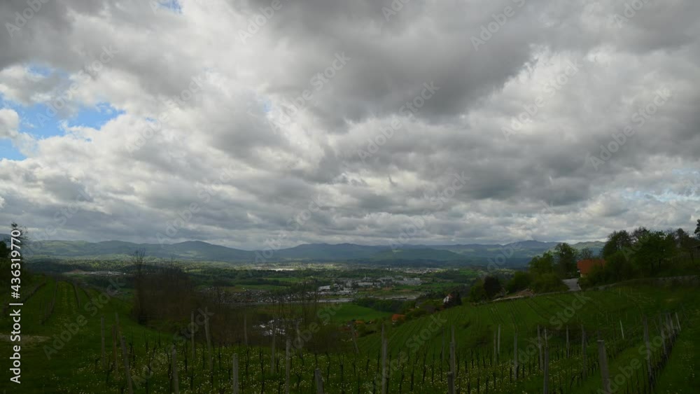 Time lapse of clouds moving over large basin in Slovenia. Wine fields in the foreground. Elevated view of beautiful landscape. Static shot, wide angle Time lapse of clouds moving over large basin in Slovenia. Wine fields in the foreground. Elevated view of beautiful landscape. Static shot, wide angle