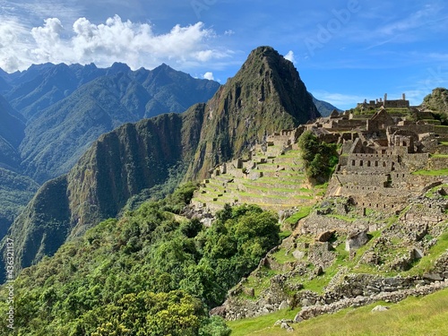 Machu Picchu great Inca lost city in Peru. Ancient Incas fortress in Peruvian Andes. Panorama of Huyana Picchu Mount. Ancient civilzation landmark in South America..