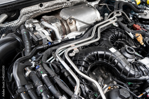 Modern turbo diesel car engine under vehicle hood. Car engine background. Car engine part. Modern powerful engine.