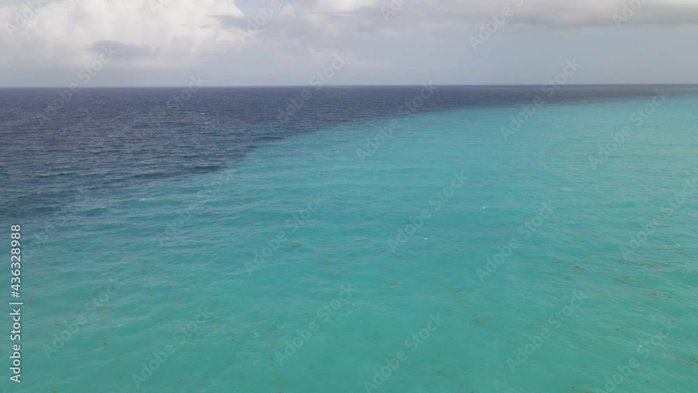 Vibrant Blue and Turquoise Caribbean Ocean Waters in Cancun, Mexico - Aerial Vibrant Blue and Turquoise Caribbean Ocean Waters in Cancun, Mexico - Aerial