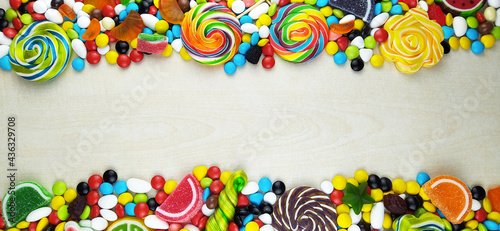colorful candies and lollipops. Top view with copy space
