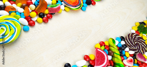 colorful candies and lollipops. Top view with copy space