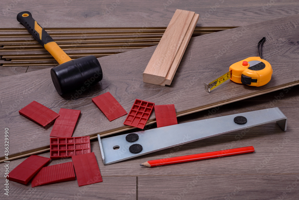 Carpenter tools on laminated flooring Carpenter tools on laminated flooring