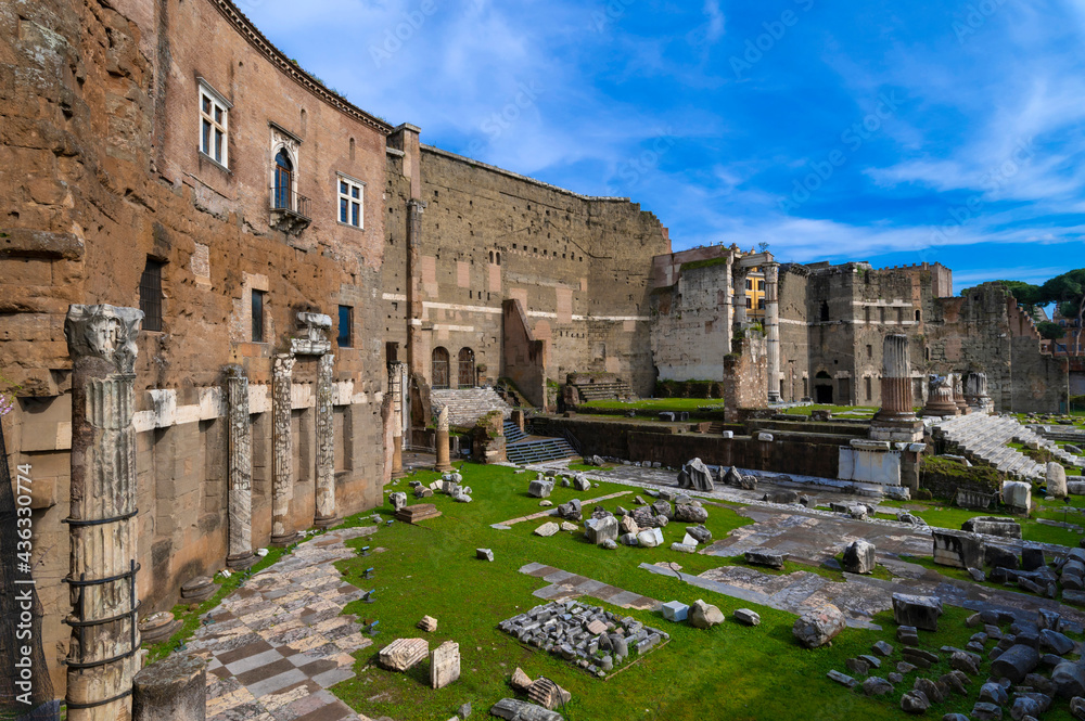 The Forum of Augustus is one of the Imperial Forums of Rome in the center of the city. Remains of the ruins of the temple of Mars Ultor with columns, marbles, capitals and mighty high walls. Italy.