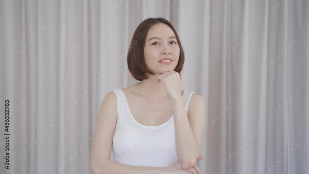 portrait of asian woman short hair in white smiling confidence face expression on background. attractive beautiful female 30's dark brown hair posing for fashion. confident and thinking act. portrait of asian woman short hair in white smiling confidence face expression on background. attractive beautiful female 30's dark brown hair posing for fashion. confident and thinking act.