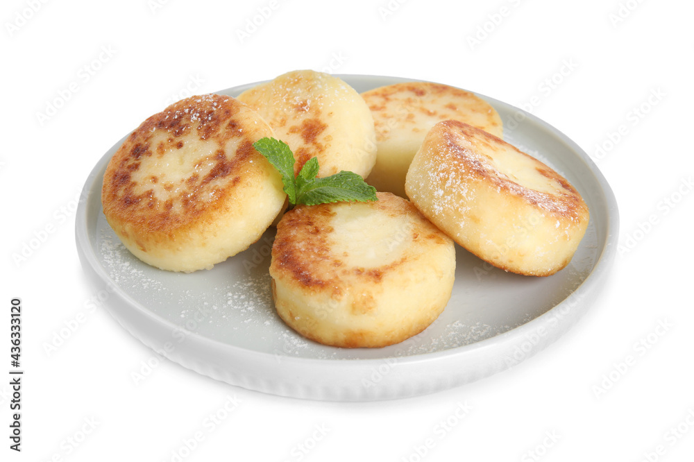 Delicious cottage cheese pancakes with mint and icing sugar isolated on white