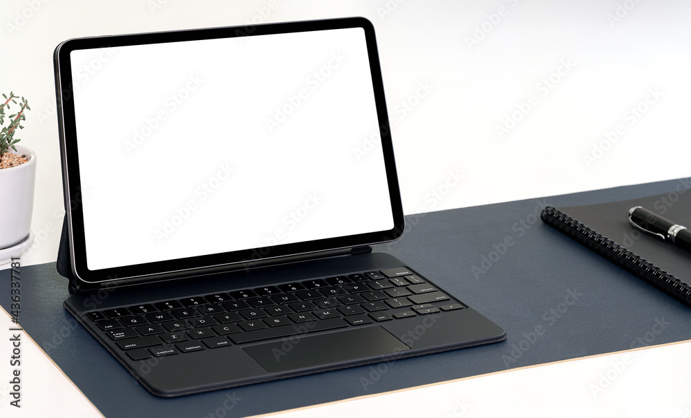 Mockup blank screen tablet with keyboard on white table. Mockup blank screen tablet with keyboard on white table.