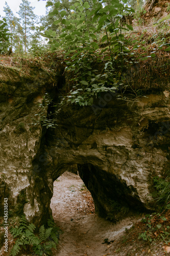 The Devil's Oven. The only natural sandstone with arches in Latvia in Liepa parish. Vintage filter.