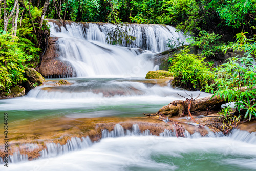 Fototapeta Naklejka Na Ścianę i Meble -  Waterfall and blue emerald water color in Huay Mae Khamin national park. Huay Mae Khamin, Beautiful nature rock waterfall steps in tropical rainforest at Kanchanaburi province, Thailand