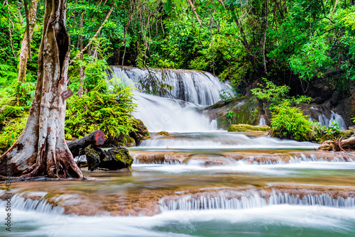 Waterfall and blue emerald water color in Huay Mae Khamin national park. Huay Mae Khamin, Beautiful nature rock waterfall steps in tropical rainforest at Kanchanaburi province, Thailand