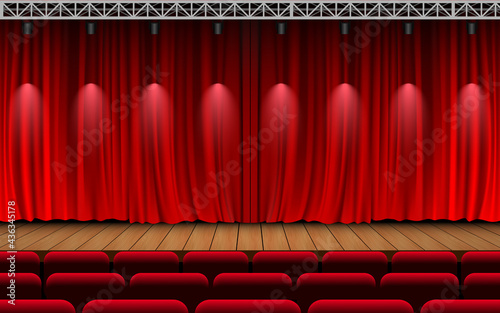 red curtain and light of spotlight on the wooden stage in the hall