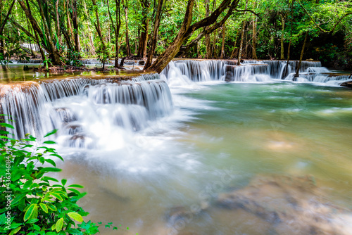 Waterfall and blue emerald water color in Huay Mae Khamin national park. Huay Mae Khamin, Beautiful nature rock waterfall steps in tropical rainforest at Kanchanaburi province, Thailand