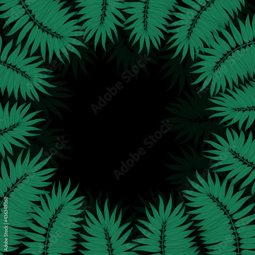 Round frame made of palm leaves on a black background.