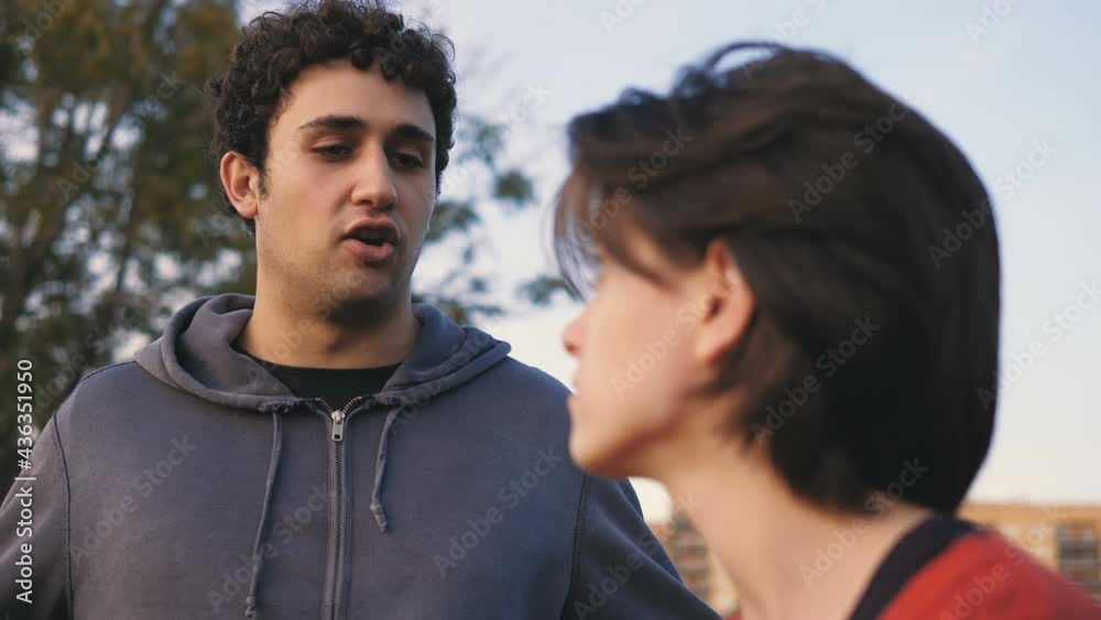 couple crisis - dissatisfied guy argues with his girlfriend who remains silent couple crisis - dissatisfied guy argues with his girlfriend who remains silent