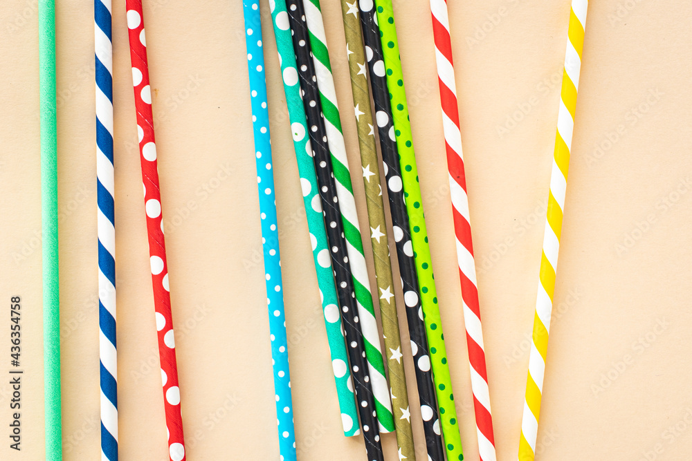 paper cocktail straws multicolored striped dotted straws scattered Flat lay useful ecology biodegradable on the table summer concept party healthy meal copy space food background paper cocktail straws multicolored striped dotted straws scattered Flat lay useful ecology biodegradable on the table summer concept party healthy meal copy space food background
