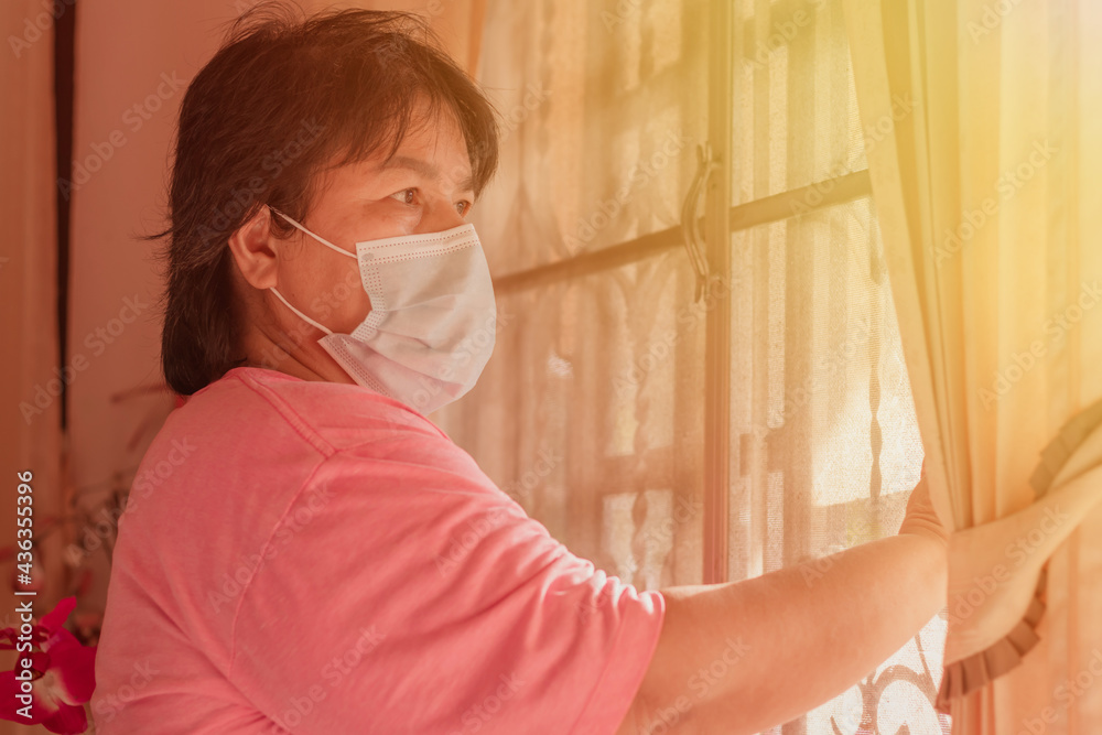 asian senior mature woman with mask medical lockdown at home.quarantine during COVID19 Coronavirus.social distancing.Mental health.Depressed mind thinking.Senior asian woman at home.patient stress. asian senior mature woman with mask medical lockdown at home.quarantine during COVID19 Coronavirus.social distancing.Mental health.Depressed mind thinking.Senior asian woman at home.patient stress.