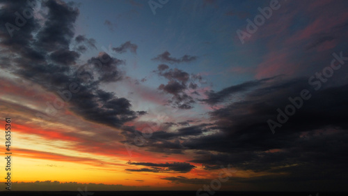 Beautiful contrasting clouds in the sky at sunset. Juicy background for design © Payllik