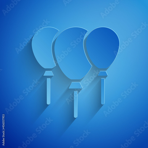 Paper cut Balloons with ribbon icon isolated on blue background. Merry Christmas and Happy New Year. Paper art style. Vector