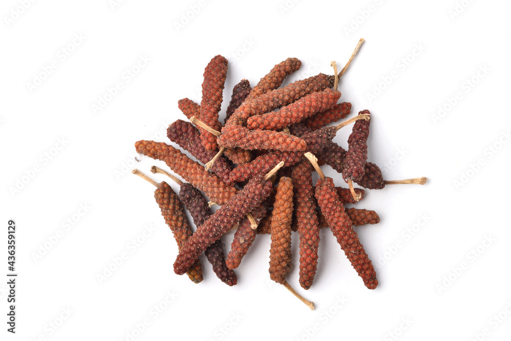 Flat lay of Dried Long pepper or Piper longum isolated on white background. Flat lay of Dried Long pepper or Piper longum isolated on white background.