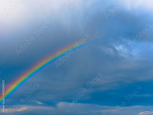 cloudy sky with rainbow after storm © Maurice Lesca