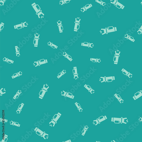 Green Police electric shocker icon isolated seamless pattern on green background. Shocker for protection. Taser is an electric weapon. Vector