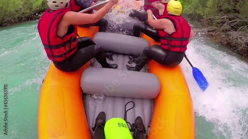 People in boat enjoy on whitewater rafting trip on Tara river in Montenegro photo