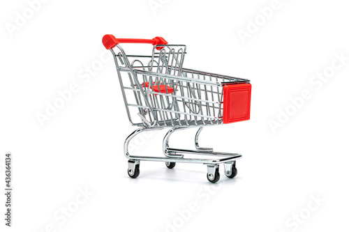 Close-up of Miniature Shopping Cart Against White Background.