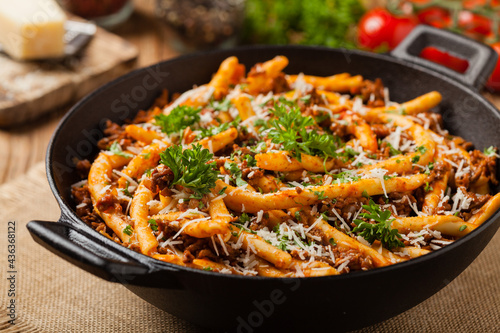 Maccheroni al ferretto with beef in ragu bolognese. Front view. © gkrphoto