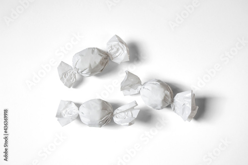 Blank packaging candy plastic sachet isolated on white background. Candy wrapper mock-up, solid white and transparent. Сan be used for design and branding.