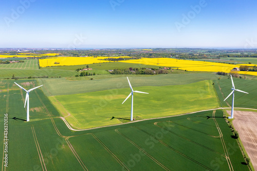Fototapeta Wind turbines that produce electricity, built on a field in Skanderborg, Denmark