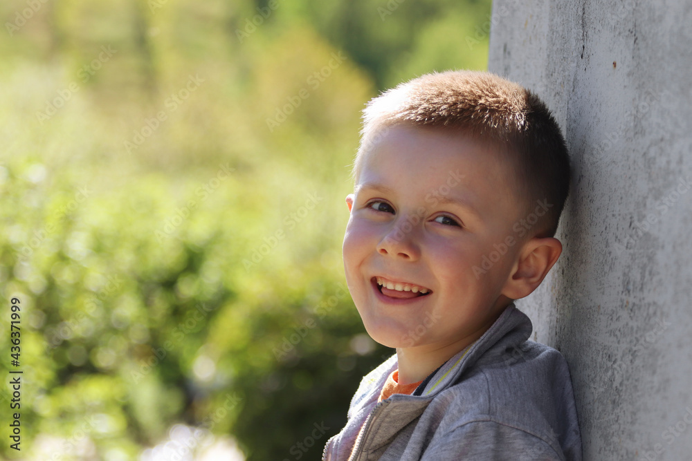 Outdoor portrait of a smiling little boy. Outdoor portrait of a smiling little boy.