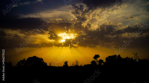 Awesome background of dark clouds before a thunder-storm. Sunny sky and clouds over the horizon