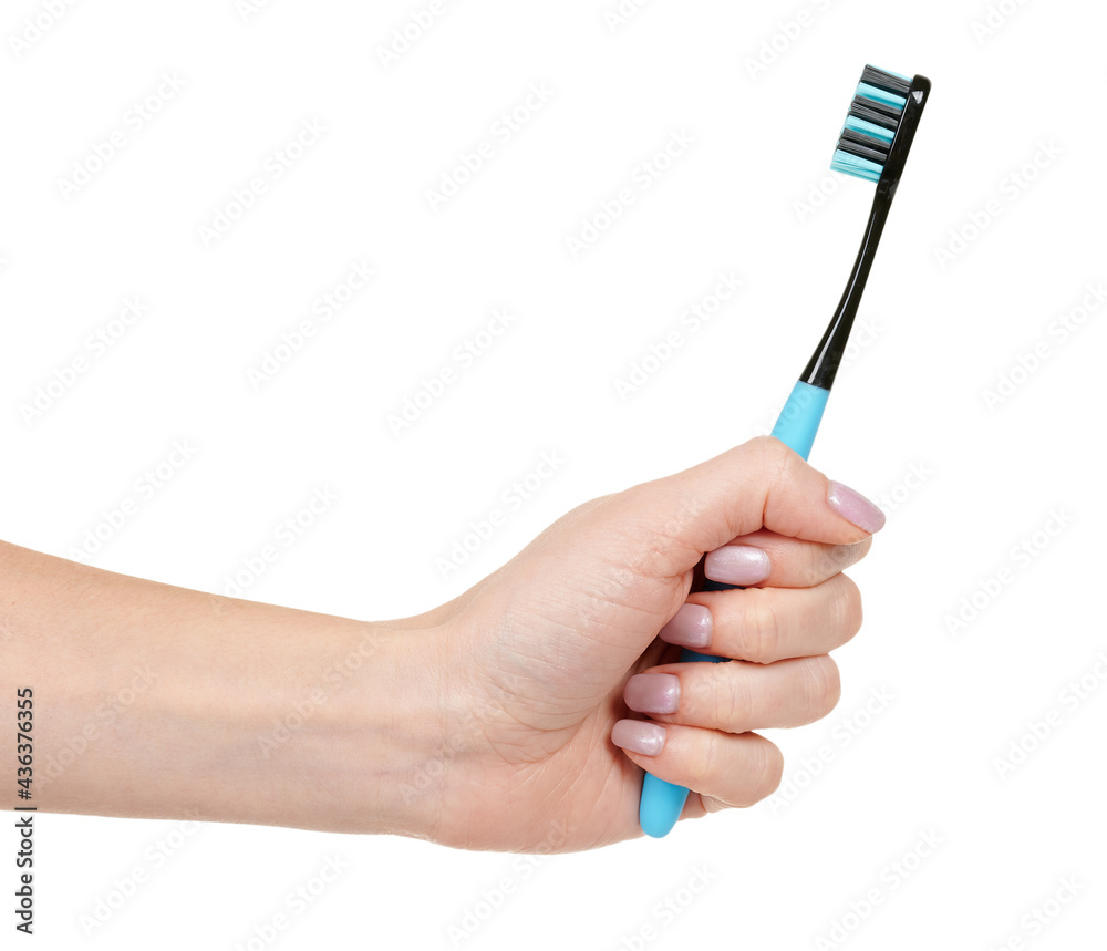 Hand with blue dental toothbrush isolated on white background Hand with blue dental toothbrush isolated on white background