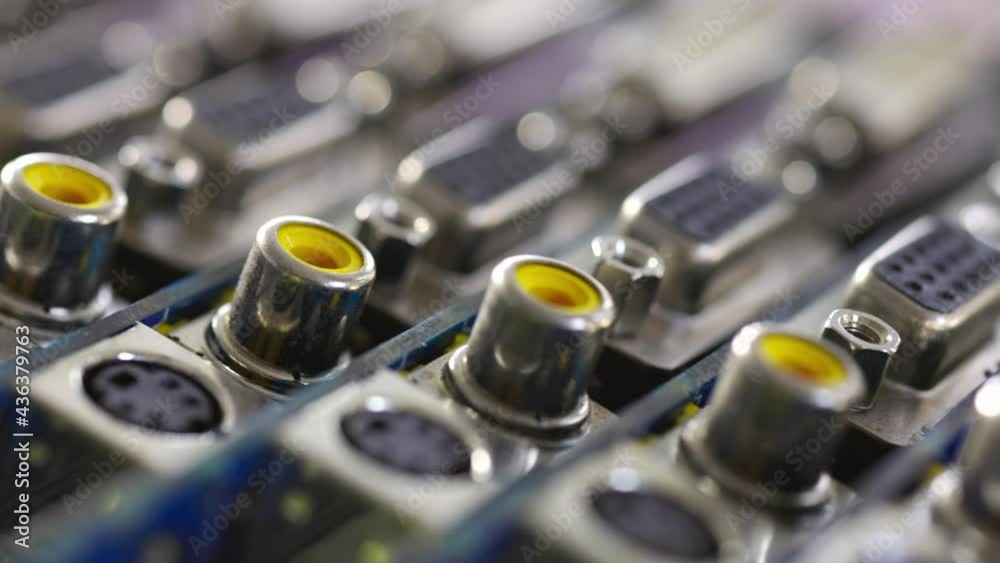 Close-up blurry metal sockets on a computer video board Close-up blurry metal sockets on a computer video board
