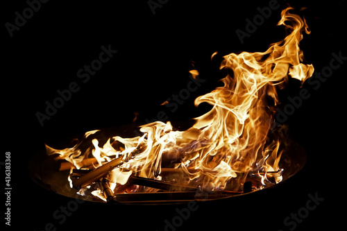 Bonfire with fantastic blazing flames and black background in the night