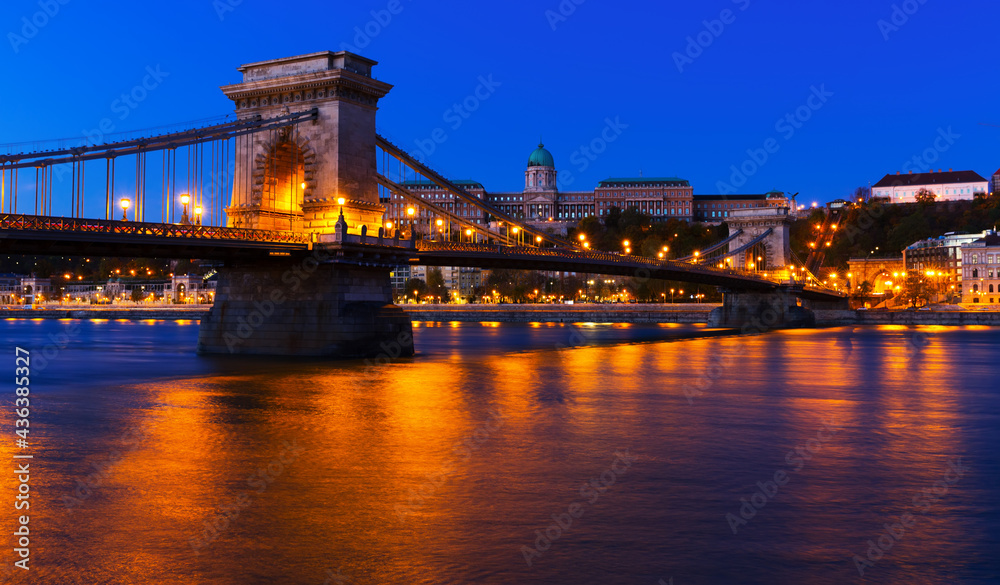 Fototapeta premium Night light of Chain Bridge near Buda Fortress is hungarian landmark outdoors.