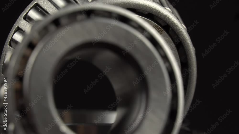 Cyclic seamless video with bearings rotating on a turntable on a black ...