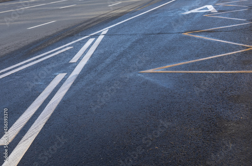 Road markings on the asphalt. Public transport stop zone and intermittent white line